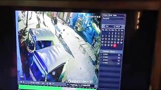 Man Sitting On A Box Of Burning Fireworks