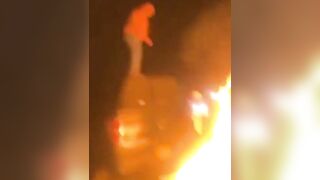 Idiot Jumps Into A Burning Bonfire And Burns Himself