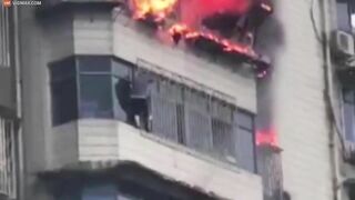 Heartbreaking Moment Man Clings To Burning Skyscraper