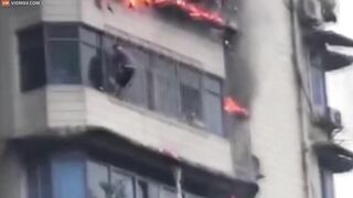 Heartbreaking Moment Man Clings To Burning Skyscraper