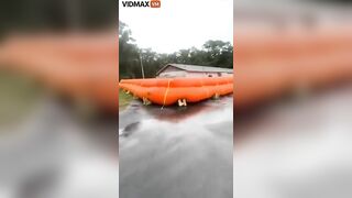 Homeowner Places Giant Flotation Devices Around His House To Prevent Flooding