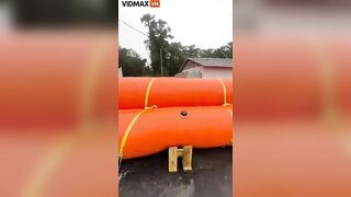 Homeowner Places Giant Flotation Devices Around His House To Prevent Flooding