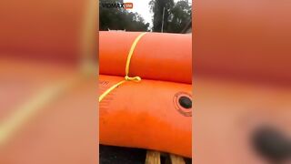 Homeowner Places Giant Flotation Devices Around His House To Prevent Flooding
