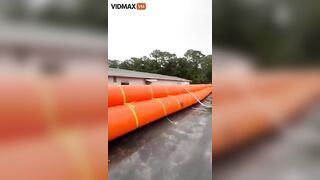Homeowner Places Giant Flotation Devices Around His House To Prevent Flooding