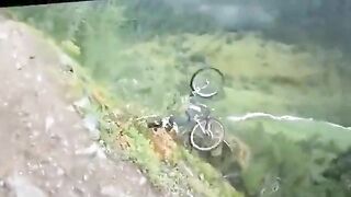 Horrifying Moment Cyclist Loses Balance And Falls Off Cliff