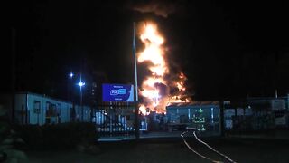 A Huge Inferno Engulfs An Oil And Gas Plant In An Industrial Area