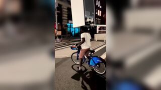 A Cyclist Carries A Refrigerator On His Head