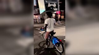 A Cyclist Carries A Refrigerator On His Head