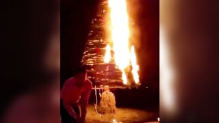 Fireworks Are Set Off On Both Sides Of The Glowing Christmas Tree