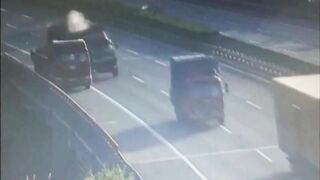 Truck Catches Fire After Colliding With Parked Vehicle