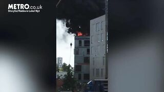 Man Escapes Burning Building By Grabbing Crane Hook
