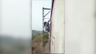 Man Performs Silly Stunt On Top Of Train And Gets Electrocuted