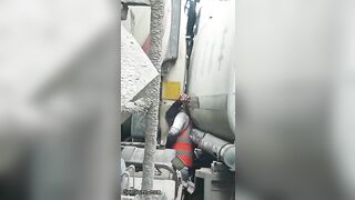 Man Trapped Between Trucks