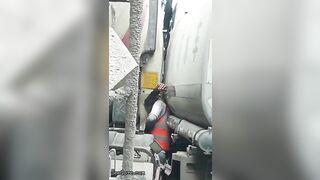 Man Trapped Between Trucks