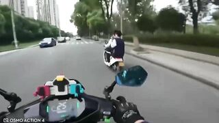 Motorcyclist Giving Middle Finger To Moped Driver
