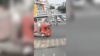 Motorcyclist's Head Crushed By Semi-trailer Truck, But Miraculously Survives