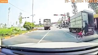 Speeding Motorbike Rider Falls Face Down Behind Truck