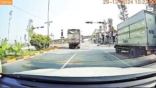Speeding Motorbike Rider Falls Face Down Behind Truck