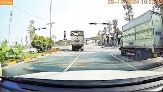 Speeding Motorbike Rider Falls Face Down Behind Truck