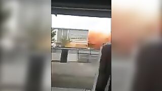 Standing In Front Of The Site Of A Chemical Explosion At A Factory