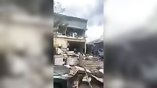 Standing In Front Of The Site Of A Chemical Explosion At A Factory