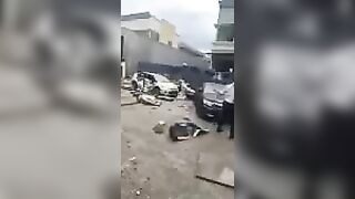 Standing In Front Of The Site Of A Chemical Explosion At A Factory