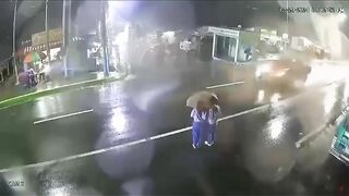 Two Girls In Vietnam Share An Umbrella