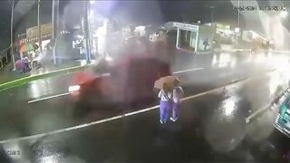 Two Girls In Vietnam Share An Umbrella