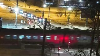 A Woman Sees A Fast-moving Train Approaching A Level Crossing