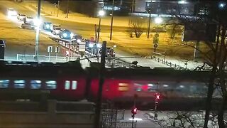A Woman Sees A Fast-moving Train Approaching A Level Crossing
