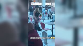 A Woman Walks Her Dog At An Atlanta Shopping Mall