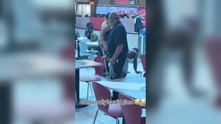 A Woman Walks Her Dog At An Atlanta Shopping Mall
