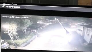 Out-of-control Tesla Crashes Through Parking Barrier In China