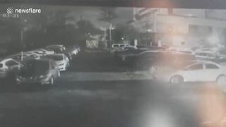 Out-of-control Tesla Crashes Through Parking Barrier In China