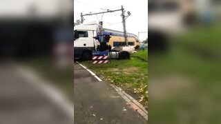 Passenger Train Collides With Trapped Truck At Level Crossing