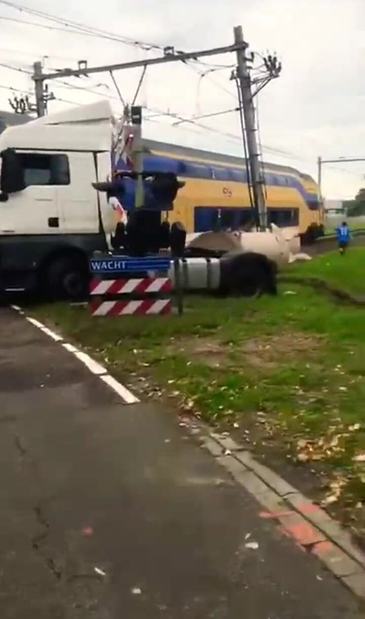 Passenger Train Collides With Trapped Truck At Level Crossing