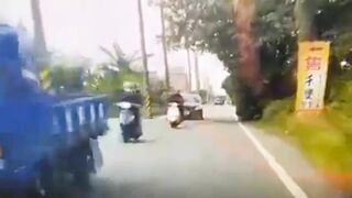 Motorcyclist Loses Control On Road