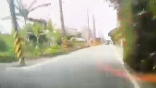 Motorcyclist Loses Control On Road