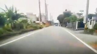 Motorcyclist Loses Control On Road