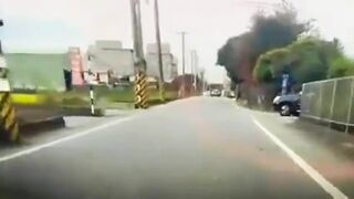Motorcyclist Loses Control On Road