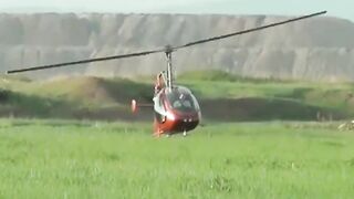 Small Helicopter Rotors Touching The Ground During Takeoff