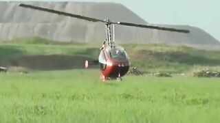 Small Helicopter Rotors Touching The Ground During Takeoff