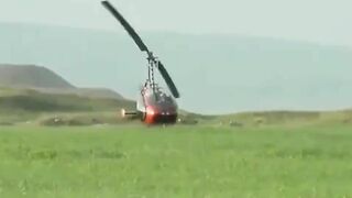 Small Helicopter Rotors Touching The Ground During Takeoff