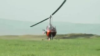 Small Helicopter Rotors Touching The Ground During Takeoff