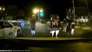 Three Cyclists Hit Taxi
