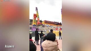 Thrill Seekers Hang Upside Down On Amusement Park Ride