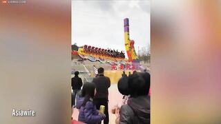 Thrill Seekers Hang Upside Down On Amusement Park Ride