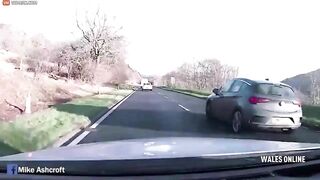 Two Cars Simultaneously Try To Overtake A Delivery Truck