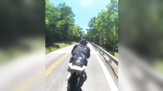 Cyclist Thrown Over Guardrail
