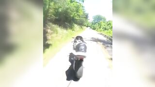 Cyclist Thrown Over Guardrail